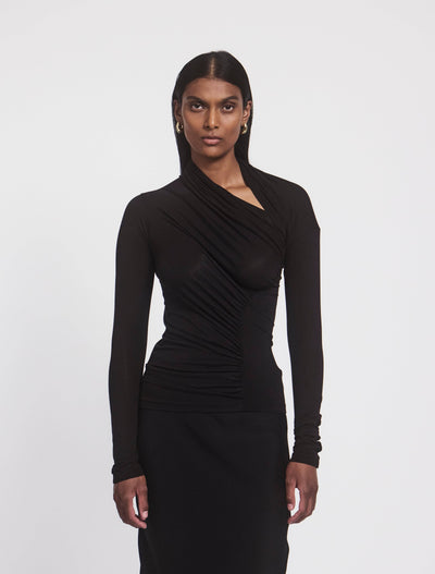 Model wearing JEANE TOP in Black, front view