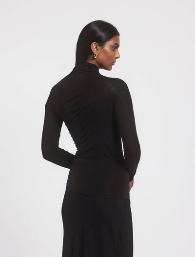 Model wearing JEANE TOP in Black, back view
